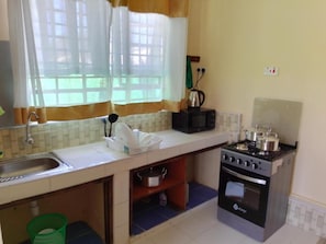 Family Chalet, Garden View | Private kitchen | Fridge, microwave, cookware/dishes/utensils