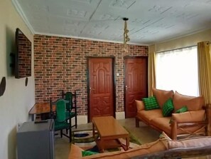 Family Chalet, Garden View | Living area | 32-inch Smart TV with digital channels - Wooden Knee cottages Nanyuki (Nanyuki)