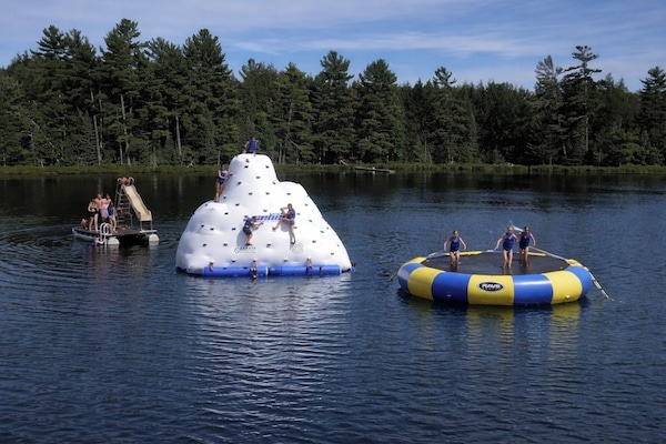 kids favorite inflatables: iceberg and water bouncer, water sled on the raft