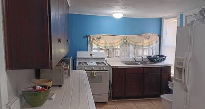 Cozy 3-bedroom cabin with AC and full kitchen and laundry.