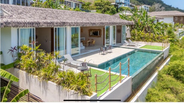 A modern villa with a pool, outdoor seating, and lush greenery. - 180° Sea View Villa | Private Infinity Pool Bang Por Koh Samui (Koh Samui)