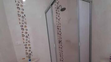 Double Room | Bathroom | Shower, towels, soap, toilet paper