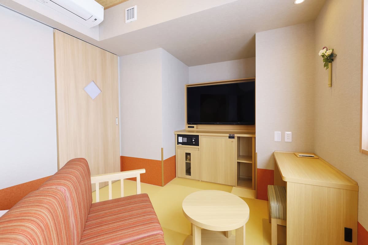 Coffres-forts dans les chambres, fer et planche Ă repasser