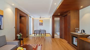 Suite with Garden View | Living area | 55-inch flat-screen TV with satellite channels