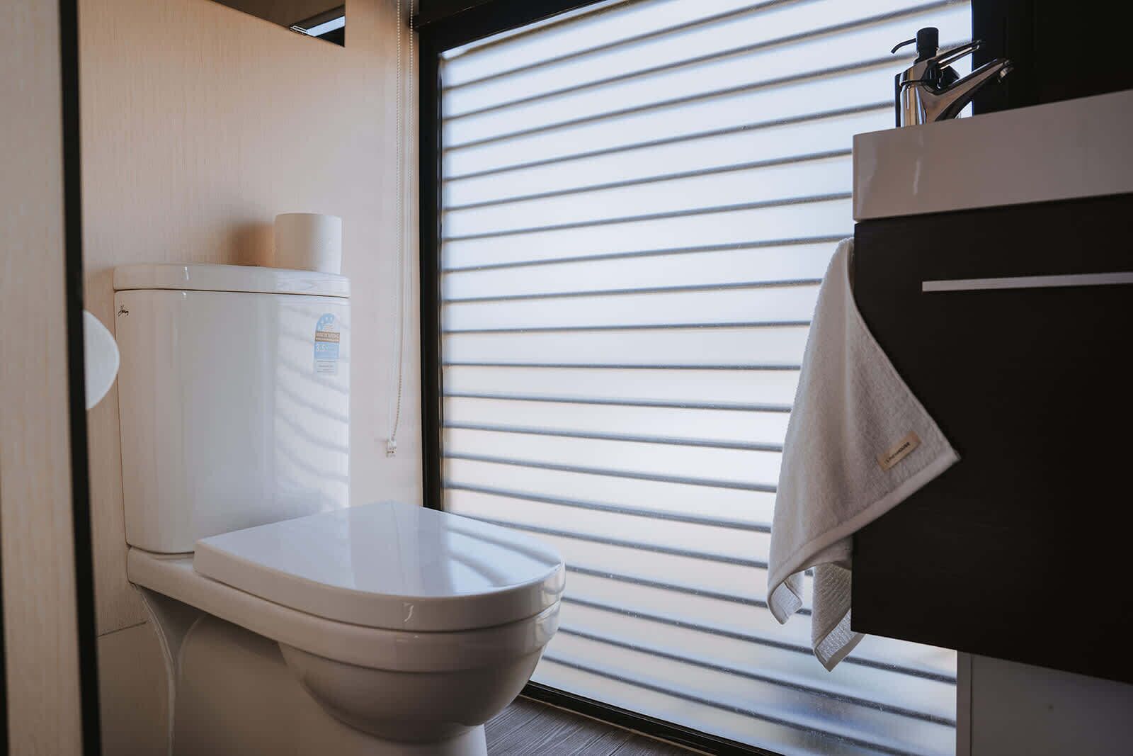 Shower, hair dryer, towels, shampoo