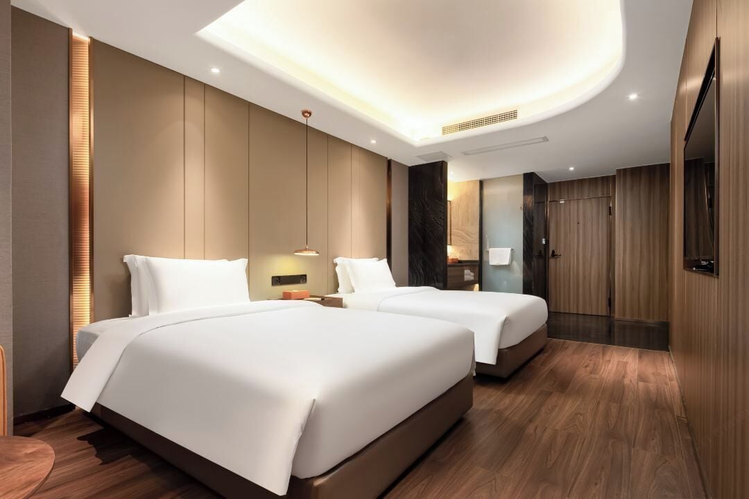 Habitació amb dos llits individuals superior | Cortines opaques, planxa i posts de planxar i wifi gratuïta 