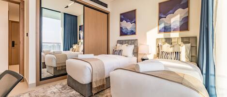 2 chambres, coffres-forts dans les chambres, fer et planche à repasser