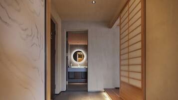 Luxury Suite, Sea View | Bathroom | Separate tub and shower, rainfall showerhead, free toiletries