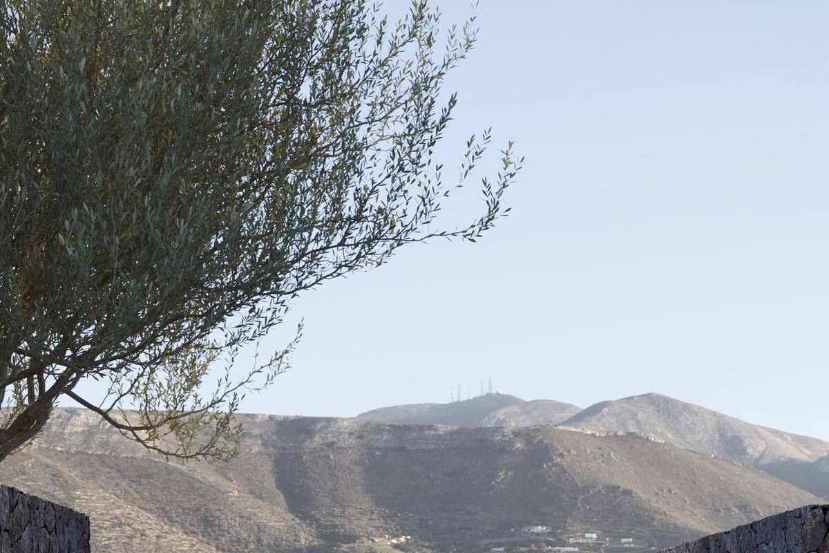 A poolside view with a clear view of a mountainous landscape and a town in the distance.