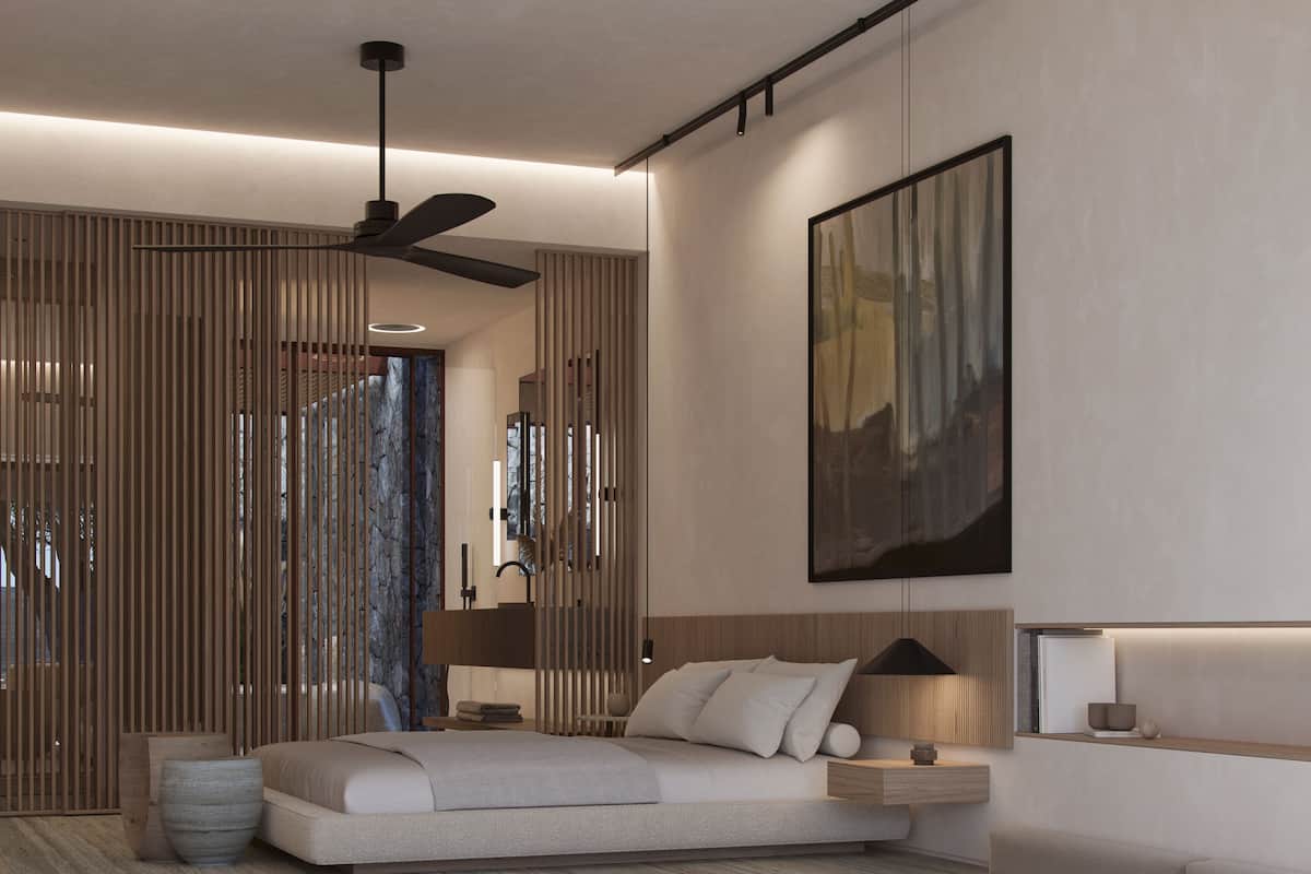 A modern living room with a sectional sofa, a round coffee table, and a large painting on the wall.