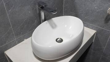 Hair dryer, slippers, towels, soap