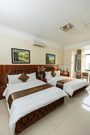 Family Room, City View | Desk, blackout drapes, soundproofing, iron/ironing board