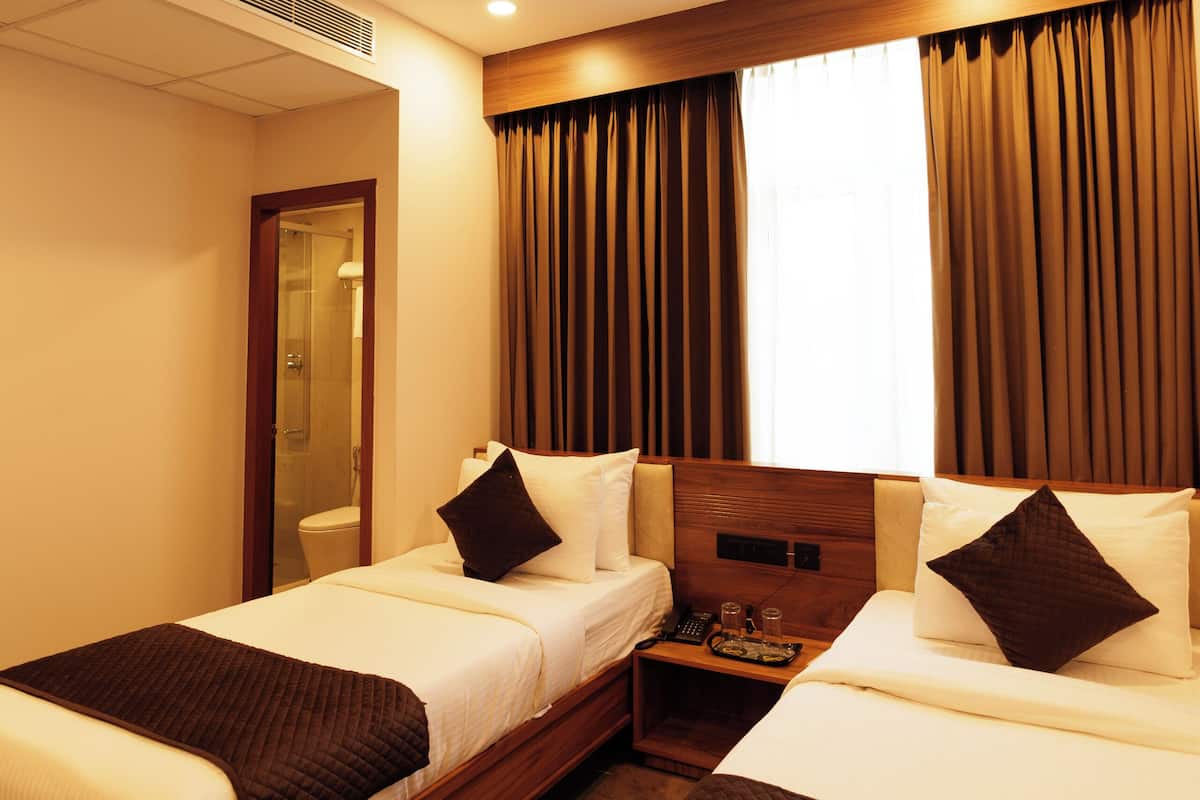 Deluxe Twin Room, City View | Desk, laptop workspace, iron/ironing board, free WiFi