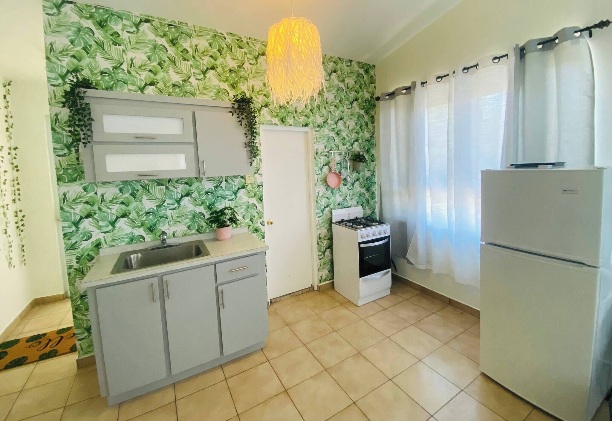 Fridge, microwave, coffee/tea maker, cookware/dishes/utensils