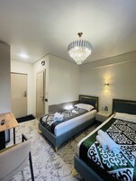 Twin Room | Minibar, desk, laptop workspace, blackout drapes