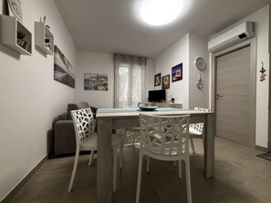 Apartment, 1 Bedroom, Balcony | Dining room - Accommodation in the Vibrant Heart of Rosolina (Rosolina)