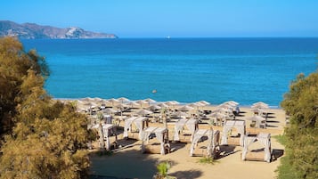 Beach nearby, white sand, beach cabanas, sun loungers