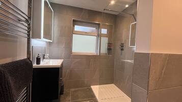 Shower, hair dryer, towels, soap