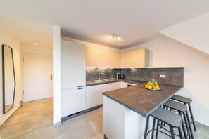 Comfort Apartment, Balcony, Garden View | Private kitchen | Full-size fridge, microwave, oven, stovetop