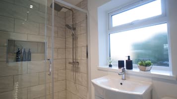 Shower, hair dryer, towels, soap