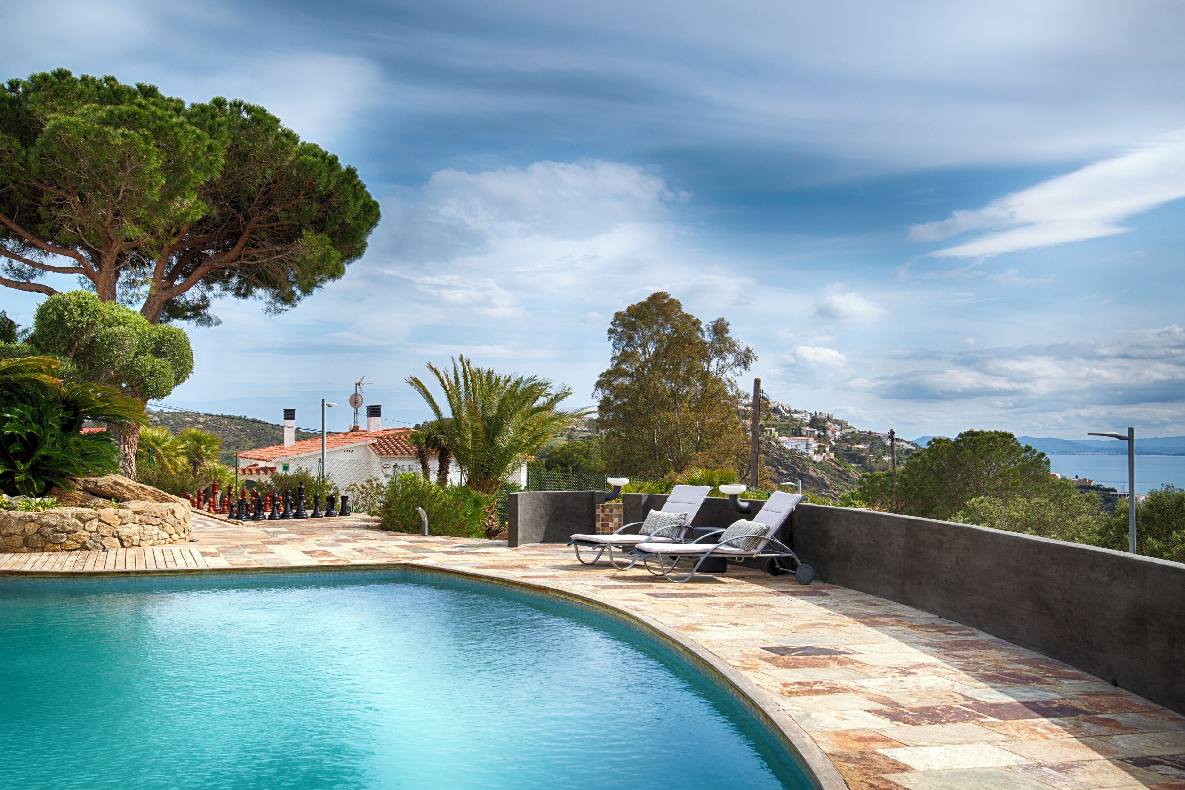 Seasonal outdoor pool, pool loungers