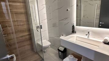 Hair dryer, towels, soap, toilet paper