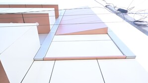 A modern building with a flat roof and visible electrical wiring. - Nirmalya Guest House (Brahmapur)
