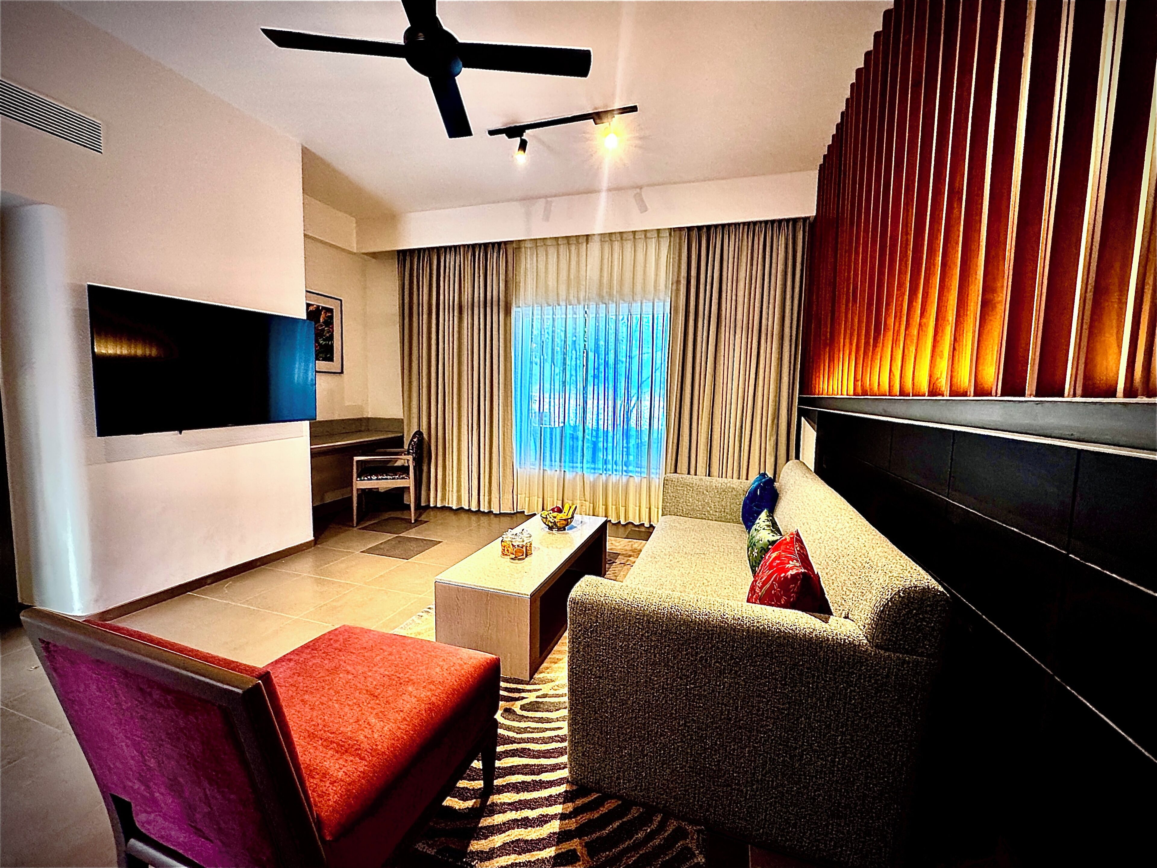 Junior Suite, River View | Living area | 50-inch LED TV with digital channels, ping pong