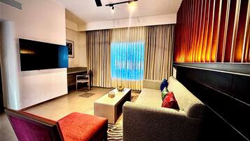 Junior Suite, River View | Living area | 50-inch LED TV with digital channels, ping pong