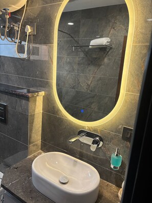 Shower, free toiletries, slippers, towels