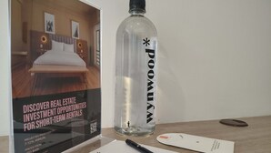 A brochure titled "Discover Real Estate Investment Opportunities for Short-Term Rentals" with a clear image of a bed and a room layout. - w Wonderful Loft in the Heart of Bogot (Bogotá)