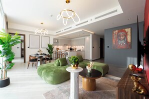 Deluxe Apartment, Balcony | Living area | 50-cm Smart TV with cable channels, Netflix, streaming services - Sky-High Luxury 3BR - The Crest Dubai (Dubai)