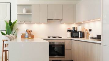 Deluxe Apartment, Balcony, Pool View | Private kitchen | Fridge, microwave, oven, stovetop