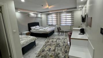 Deluxe Room, City View | Desk, laptop workspace, free WiFi