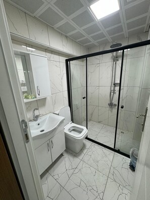 Shower, towels, soap, shampoo