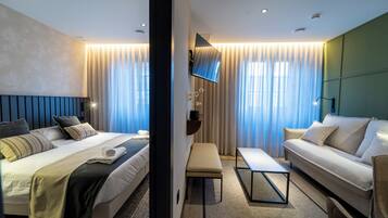 Premium bedding, laptop workspace, blackout curtains, iron/ironing board