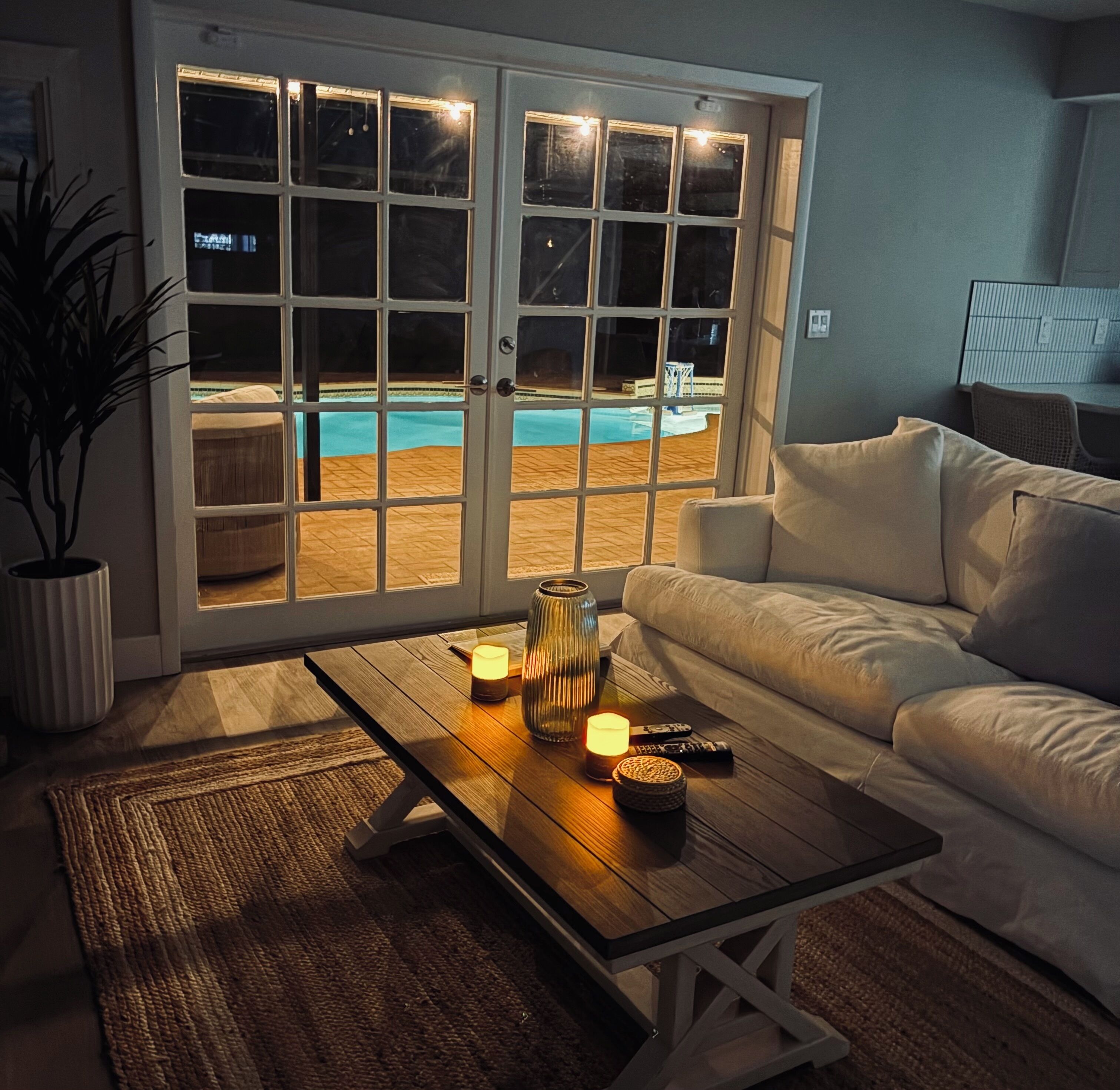 family room overlooking the pool at night