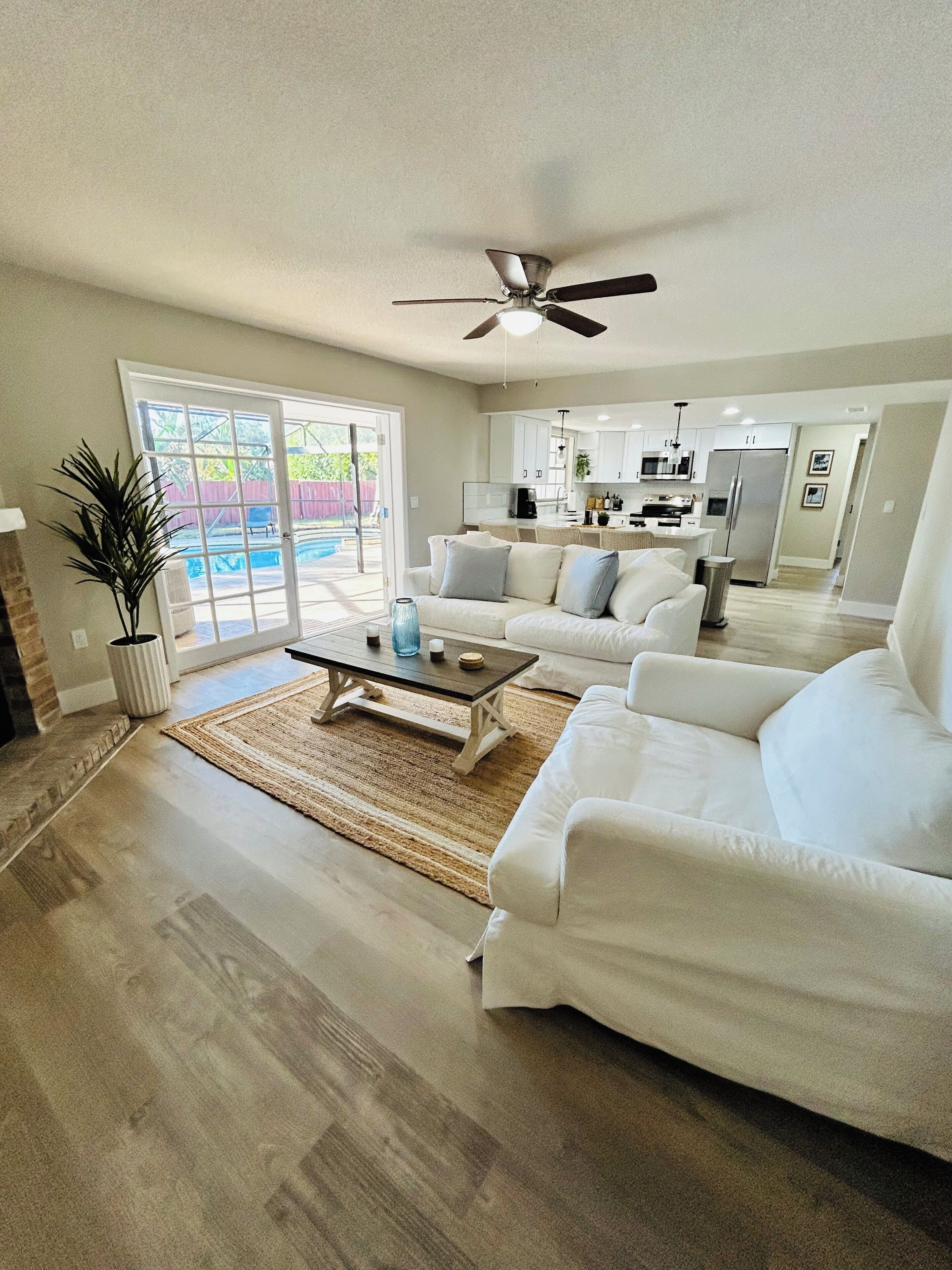 Family room attached to the kitchen and overlooking the pool. 