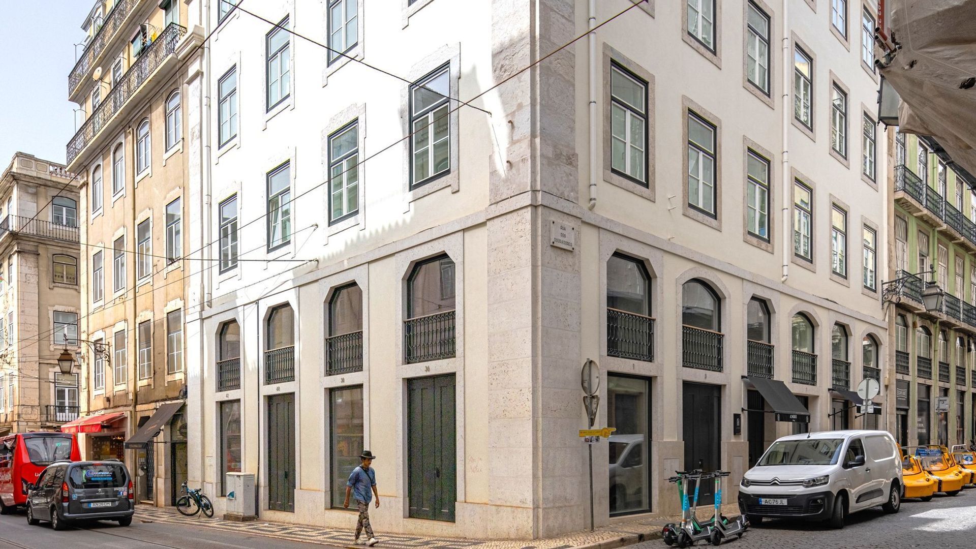 A multi-story building with a classic architectural style, featuring large windows and balconies.