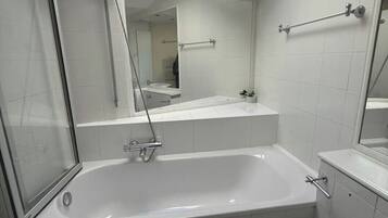 Shower, hair dryer, towels, soap