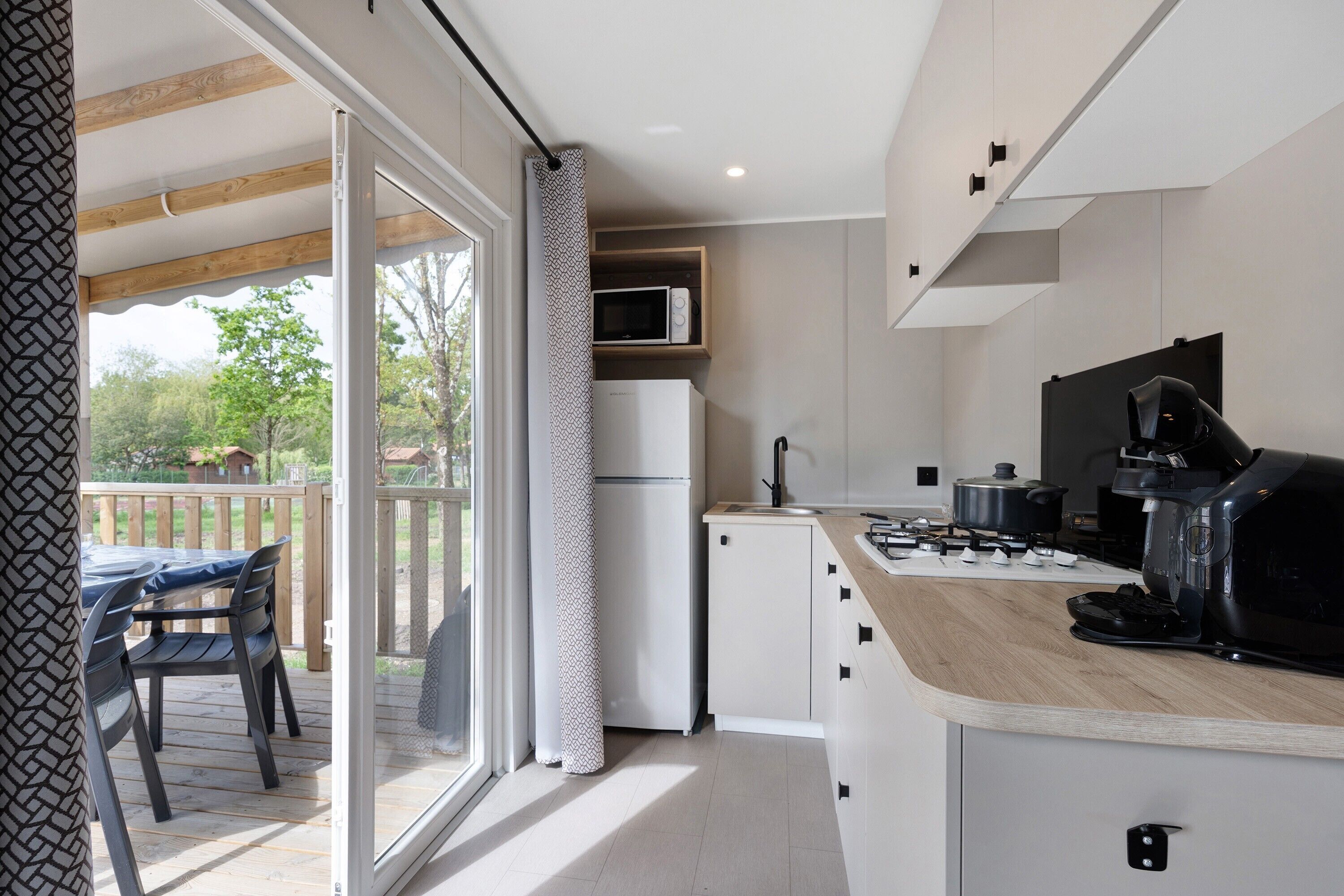 Fridge, microwave, stovetop, coffee/tea maker