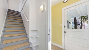 A staircase with a handrail and a light fixture above it. - The Pearl, 2 Unit Stay for 10 (St. Augustine)