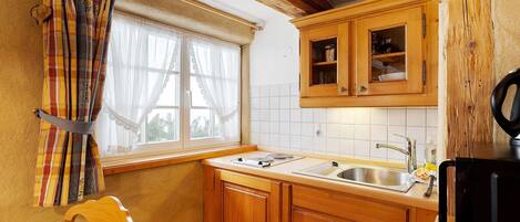 Fridge, microwave, stovetop, coffee/tea maker