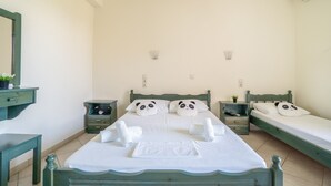 A bedroom with two beds, a nightstand, a dresser, and a mirror. - Odysseia Apartment 4 - 2 Min Walk to Beach, 3 Adults, Terrace, Wi-Fi & AC (Nikiana)
