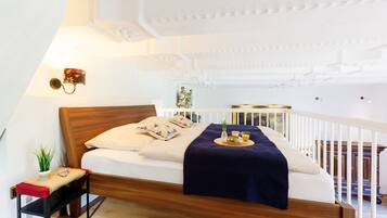 Tabla de planchar con plancha, wifi y ropa de cama