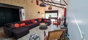 TV, fireplace - Gîte La Ferme Du Mesnil with Private Terrace, Wi-Fi, and Air Conditioning (Sèvremont)