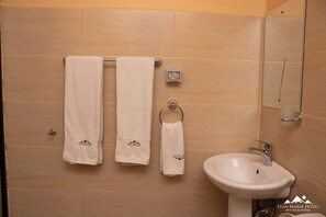 Deluxe Double Room, City View | Bathroom | Shower, slippers, towels, soap