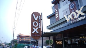 A hotel named 'Vox' with a sign indicating 'Executive Stay'. - Vox Holiday (Palakkad)