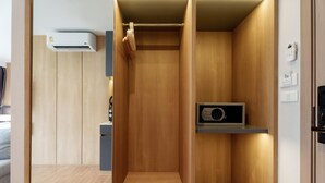A modern, compact elevator with a wooden finish and a built-in security system. - Beachfront 1524 Wyndham Gardens Condo Naithon (Sa Khu)