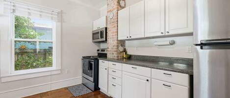 Apartment, 1 King Bed with Sofa bed, Patio, Garden View (The Pearl Unit A) | Private kitchen